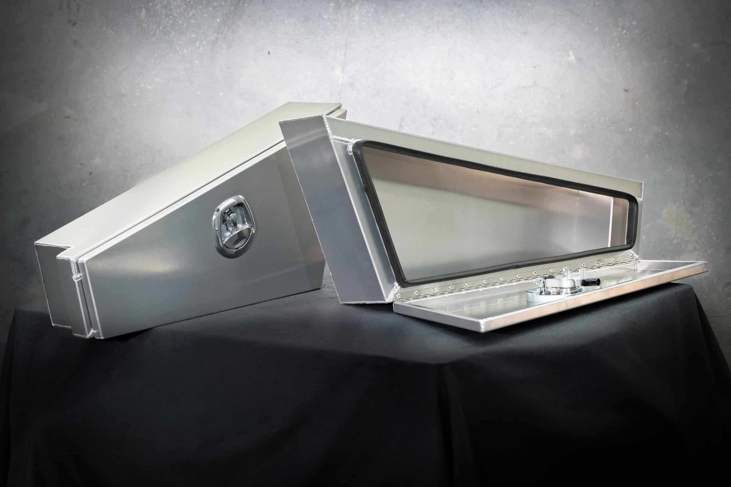 Heavy-duty tapered aluminium under-tray toolboxes with weatherproof seals and piano hinge opening by Oz Chivalry