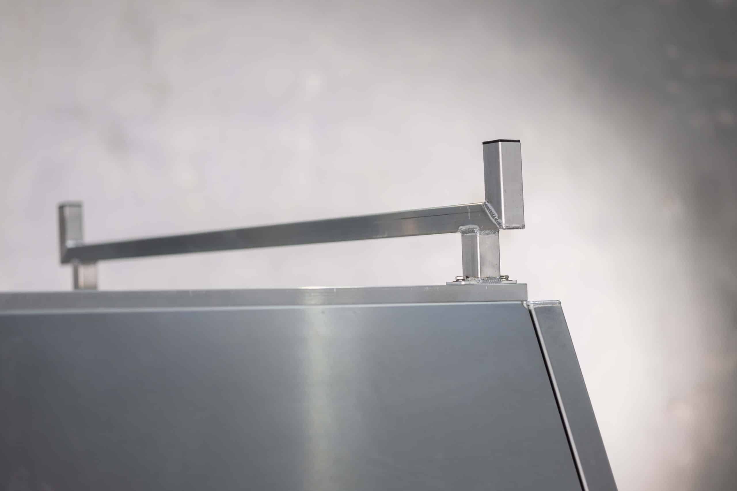 Close-up of roof bar bracket installed on top of UTE canopy