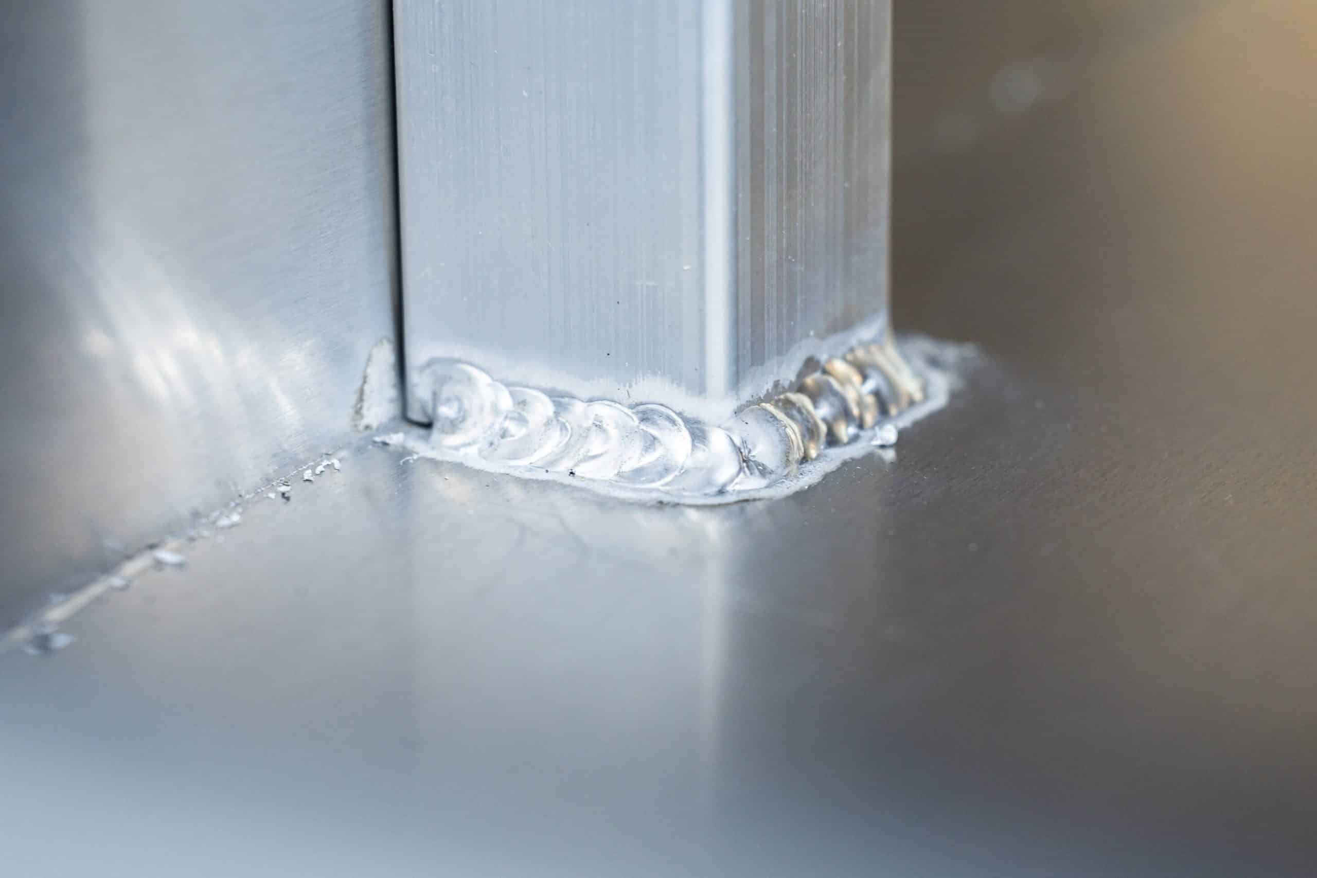 Close-up of welded aluminium joint inside a UTE canopy
