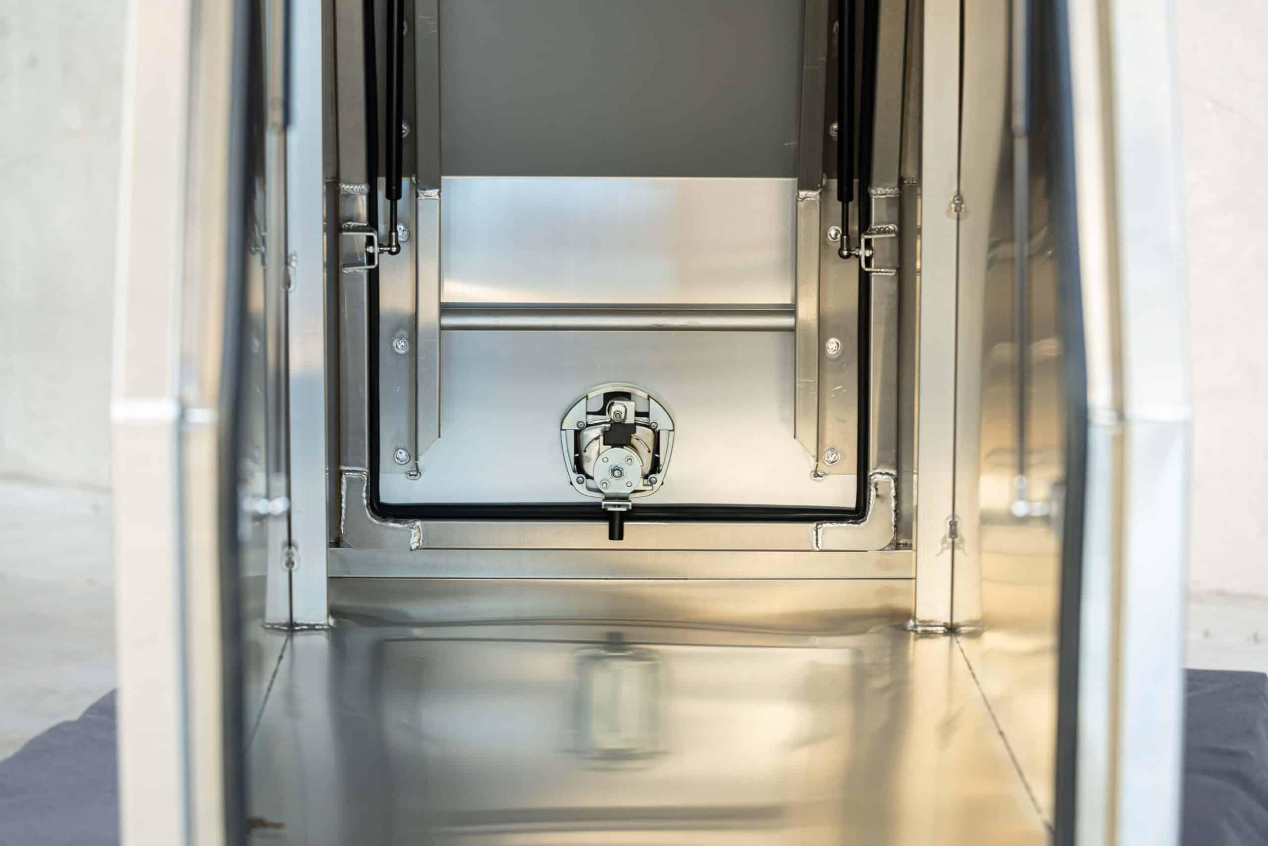 Close-up view of the whale locking mechanism inside a UTE canopy box