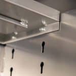 Heavy-duty canopy showing framed shelving system with soft-close fittings
