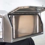 Aluminium UTE canopy with side doors open upwards, showing the spacious interior and reinforced frame