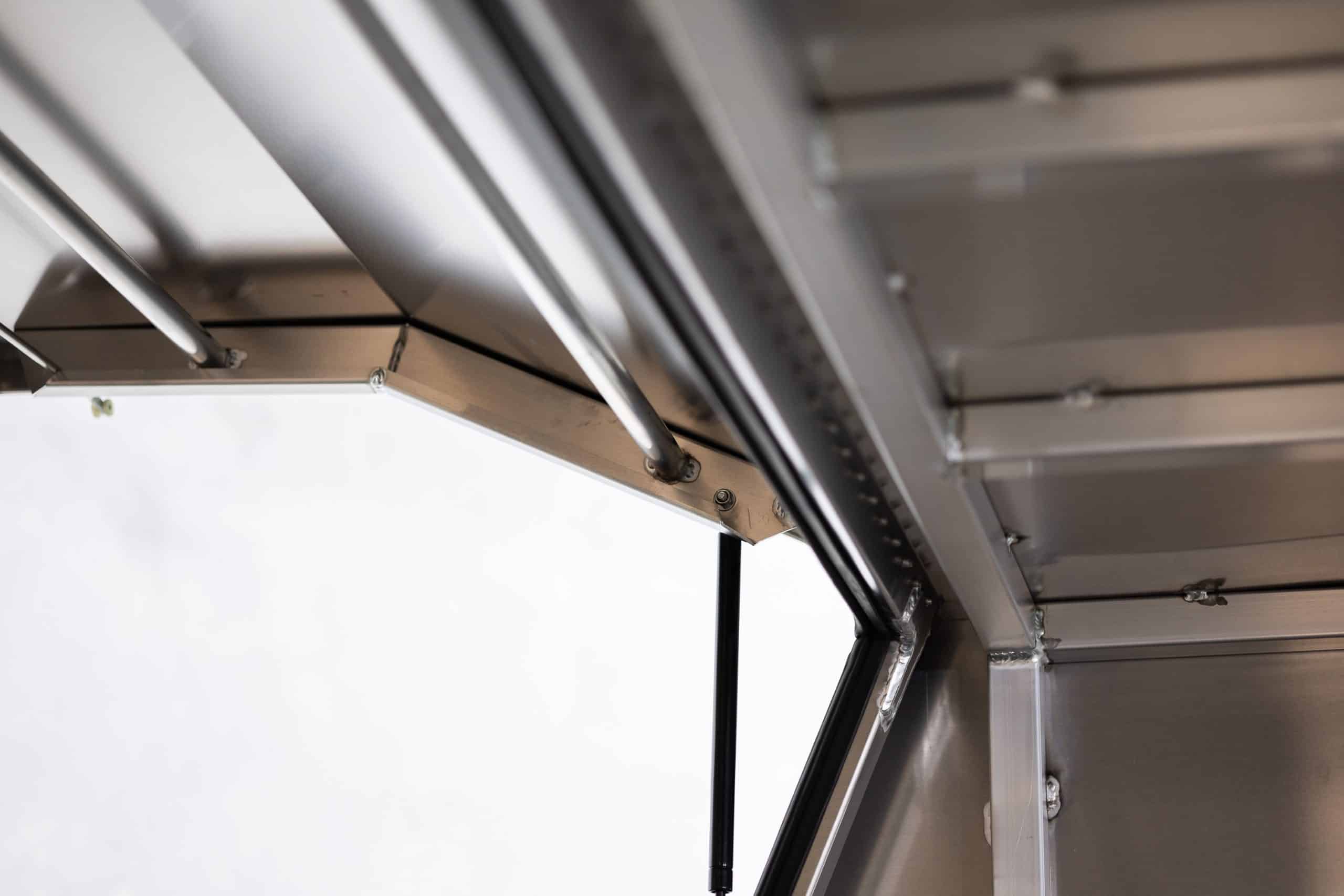 Black aluminium UTE canopy interior with reinforced frame and shelves