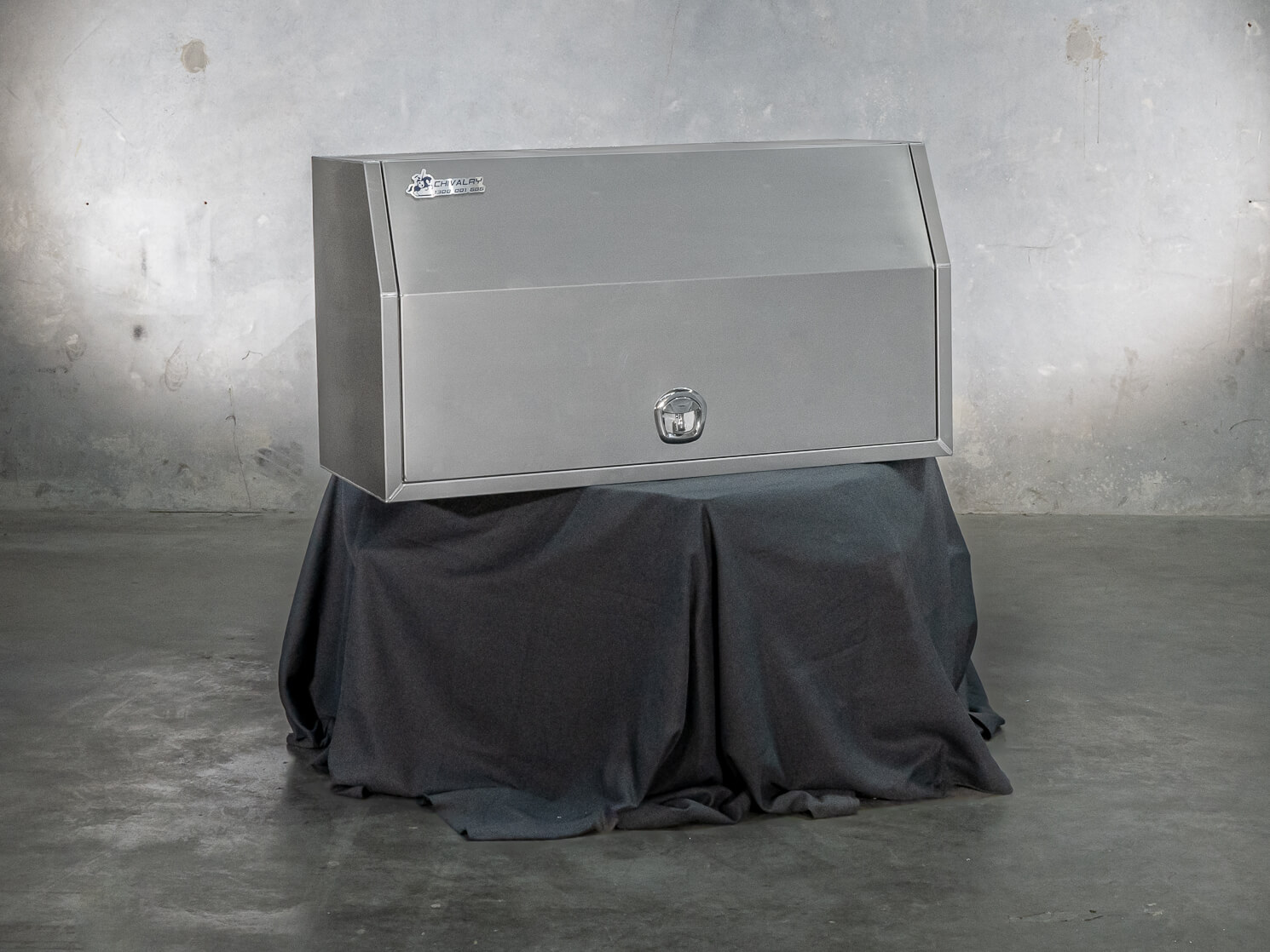 Closed aluminium UTE canopy displayed on stand with black cover