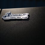 Branded Chivalry logo plate mounted on the exterior of a UTE canopy