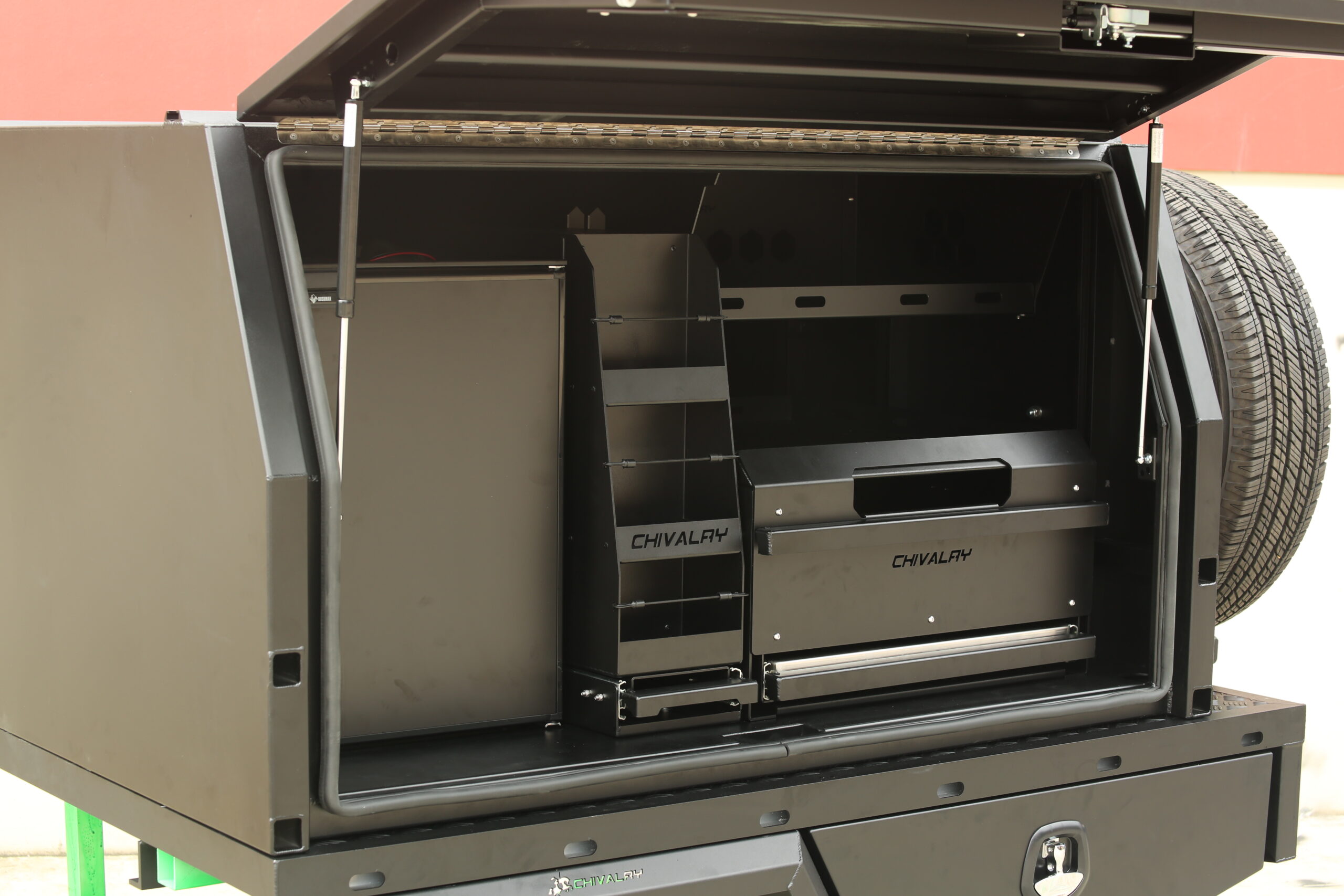 Black aluminium UTE canopy with multiple internal shelves and drawers